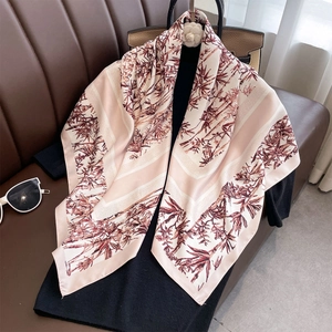Classic silk-like square scarf featuring bamboo leaf patterns on pink background