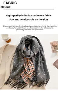 Detail of soft gray and orange checkered cashmere-like scarf with B-pattern and fringe