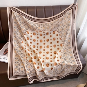 Elegant bohemian floral print silk scarf in beige and orange for autumn sun protection