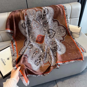 Elegant paisley print silk shawl in vintage brown and orange tones for women