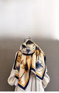 Detailed texture of imitation cashmere scarf featuring vintage floral jacquard and tassels