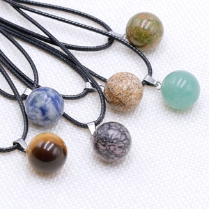 Natural 14mm crystal ball pendants set with tiger eye and aventurine on black cords
