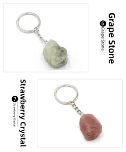 Detail view of natural grape stone and strawberry crystal keychains with metal rings