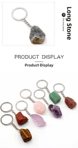 Macro view of assorted raw natural crystal gemstones on metal keychains in various colors