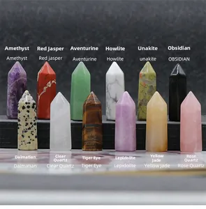 Detailed collection of 12 natural crystal hexagonal pillars including amethyst and tiger eye