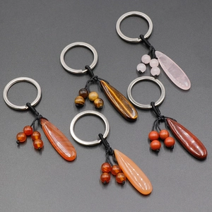 Five assorted teardrop natural stone keychains with polished quartz and tiger eye pendants