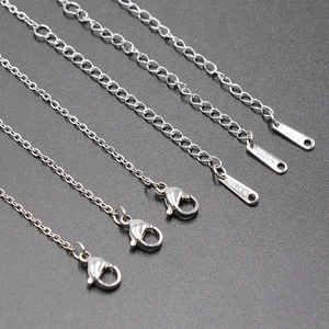 Five silver stainless steel extender chains with lobster clasps and S.STEEL engraved charms