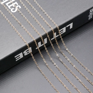 Close-up of elegant rose gold link chains for DIY jewelry making on dark background
