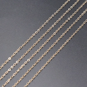 Close-up of bright gold-plated O-link chains for DIY jewelry making and necklace crafts