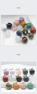 Macro shot of assorted natural crystal apple pendants with silver leaf metal clasps