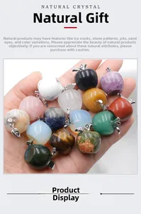 Detailed close-up of apple-shaped natural crystal pendants with metallic leaf accents