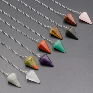 Assorted hexagonal crystal pendulum pendants in natural quartz and tiger eye with silver chains