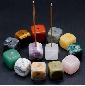 Detailed view of twelve mixed natural crystal cube incense burners with center drill holes