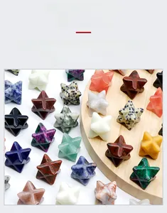 Collection of assorted natural crystal Merkaba stars displayed on a wooden stand