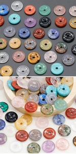 Macro view of assorted natural stone donut beads for DIY jewelry and pendants