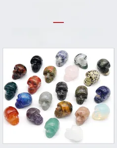 Macro detail of various hand-carved natural crystal skull figurines for Halloween decor