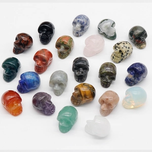 Polished 1-inch carved crystal skulls made of natural gemstones and healing stones