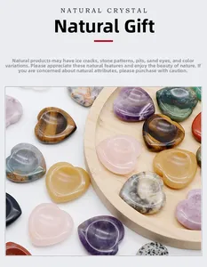 Detailed view of polished 40mm heart-shaped natural crystal stones in various minerals