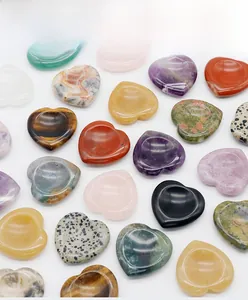 Detailed top view of heart-shaped natural crystal energy stones in various gemstone colors