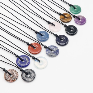 Various natural crystal donut necklaces with colorful round gemstones and black woven cords
