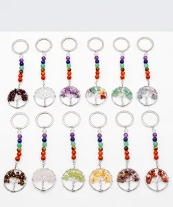 Detailed set of 12 tree of life keychains featuring colorful natural crystal stones