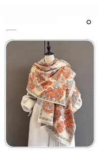 Close-up of vintage beige scarf with peony floral print and fine fringe detail