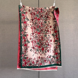 Detailed macro view of paisley cashmere-feel scarf with vintage floral patterns and tassels
