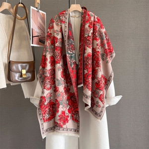 Retro floral jacquard shawl scarf with peony print and tassels over a beige wool coat