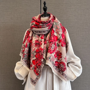Macro shot of retro peony jacquard scarf with red flowers and fine fringe detail