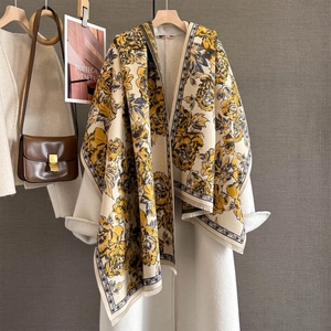 Detail of vintage peony jacquard scarf with yellow floral print and fringed edges