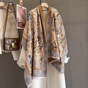 Elegant paisley jacquard shawl scarf in mustard and navy with soft tassel edges