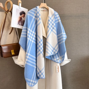 Close-up of blue and white plaid scarf with fine stitching and HangPal brand tag