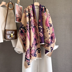 Detail of floral butterfly pattern on thick cashmere-like pashmina shawl with fringe
