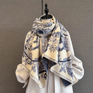 Close-up of vintage floral butterfly shawl with soft fringe edge on thick cashmere-like scarf