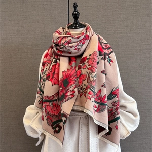 Close-up of floral pashmina scarf with red flowers and soft fringe edge detail