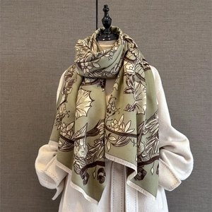 Elegant floral cashmere-feel scarf in sage green with brown patterns and fringe detail
