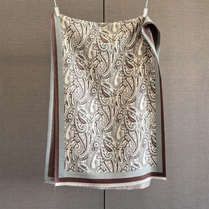 Detail of paisley pattern and soft fringe on vintage imitation cashmere scarf