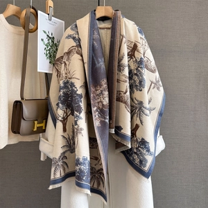 Detail of tropical jungle print shawl featuring zebras, palm trees and fringed edges