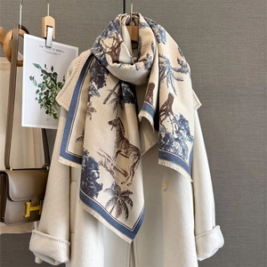 Vintage palm and zebra print cashmere-feel scarf paired with a beige wool coat