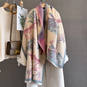 Detail of soft cashmere-feel shawl featuring exotic zebra and palm tree jungle patterns
