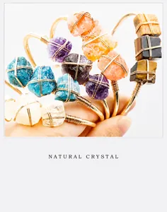 Detailed close-up of handmade wire-wrapped natural crystal raw stone gold bangles