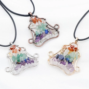 Seven chakra bell-shaped pendants with colorful natural stone chips on black cord necklaces