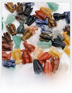 Detailed view of 1-inch mini carved angels in various natural crystal and gemstone materials