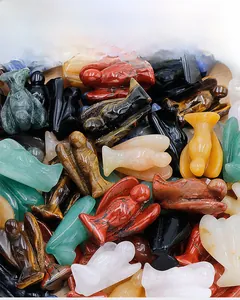 Detailed top view of assorted mini carved natural stone angels in various gemstones
