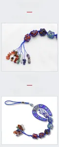 Detail of natural crystal chakra stones with blue evil eye horseshoe hanging ornament