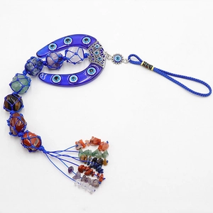 Evil Eye chakra wall hanging with horseshoe and seven natural polished crystal stones