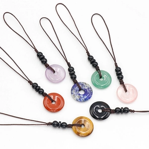 Assorted 20mm natural crystal donut pendants with braided cords for bags or keychains