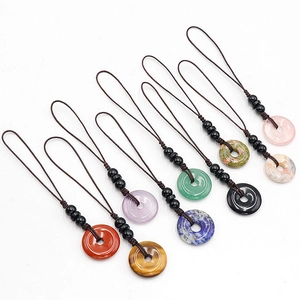 Natural crystal stone donut keychains with woven cords in eight diverse gemstones
