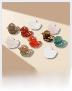Polished natural crystal duck figurines in rose quartz, tiger eye, and jade stones