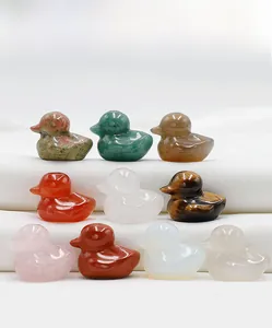 Detailed set of ten mini ducks carved from diverse natural polished crystal gemstones